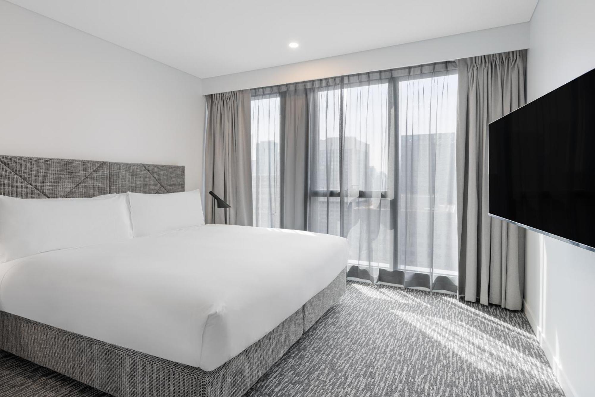 Meriton Suites Melbourne Luaran gambar A bedroom at the hotel