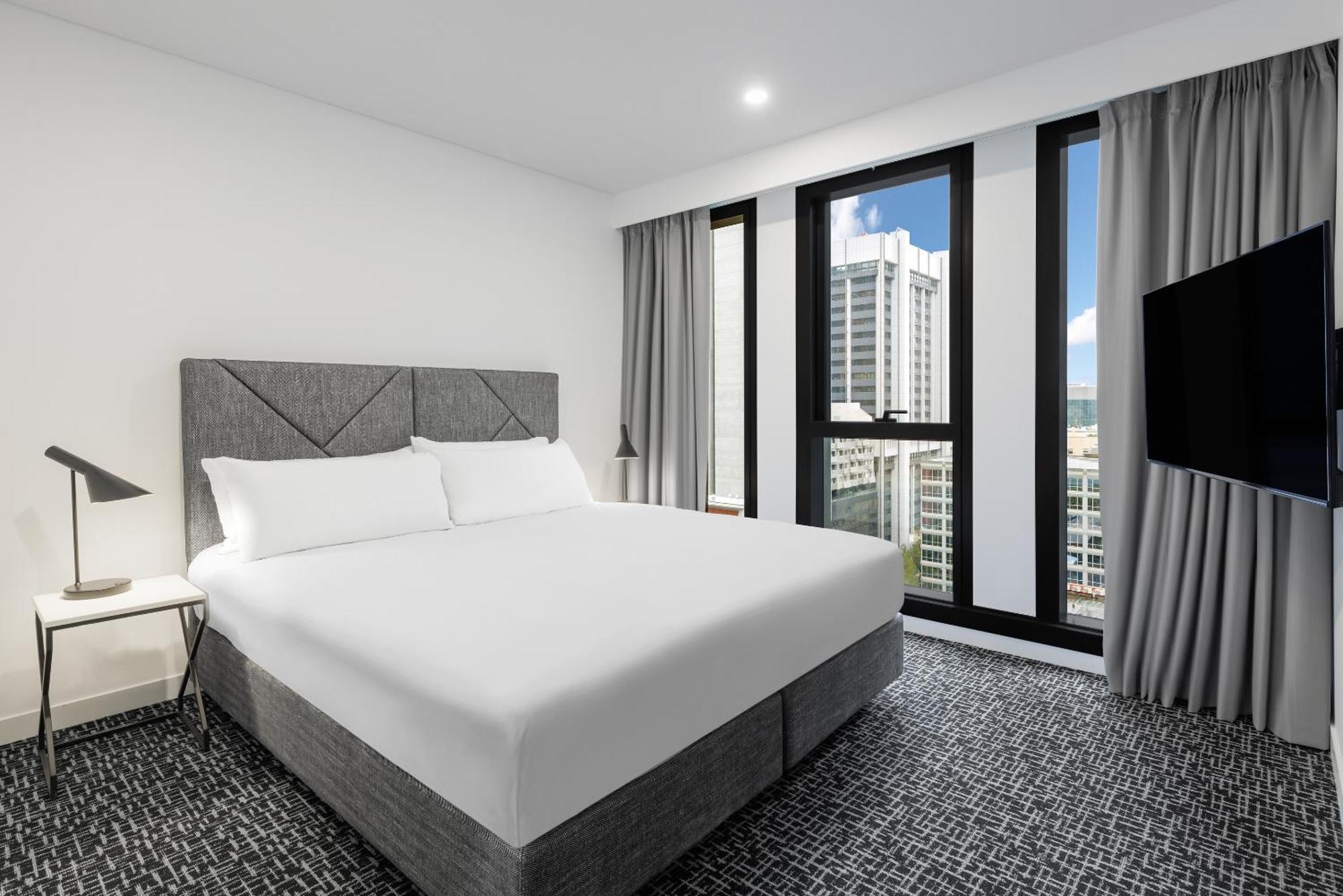 Meriton Suites Melbourne Luaran gambar A bedroom at the hotel